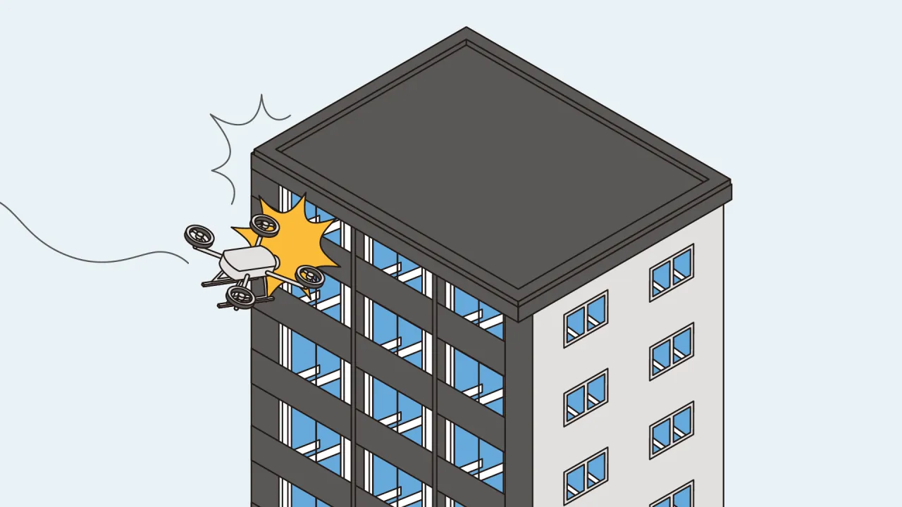 Dron uderza w budynek, pokazując potrzebę ubezpieczenia drona OC.