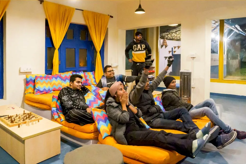 hostel common room with people interacting