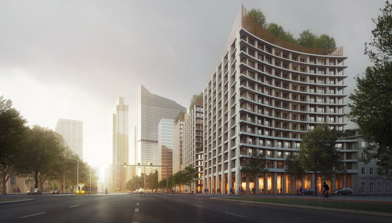 Nowoczesne osiedle z falującą fasadą i zielonymi tarasami, otoczone drzewami i wieżowcami. Na ulicy tramwaj i samochody.