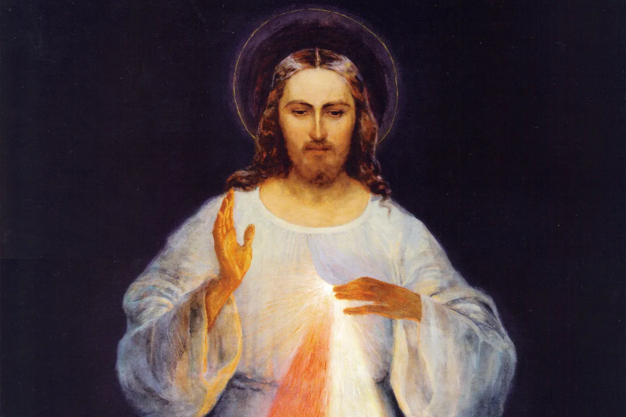 Symboliczne przedstawienie miłosierdzia Bożego, np. promienie wychodzące z serca Jezusa