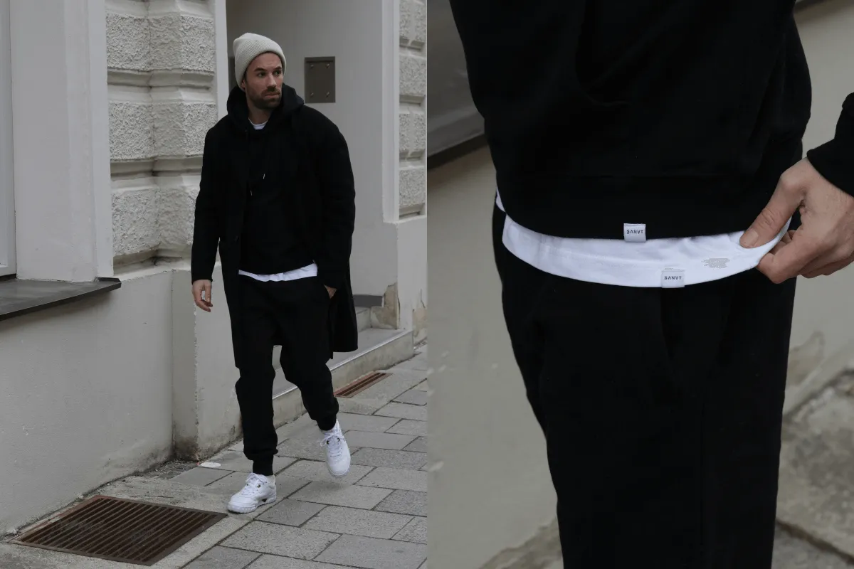 Mann trägt modernen Jogg-Suit Anzug in urbaner Umgebung