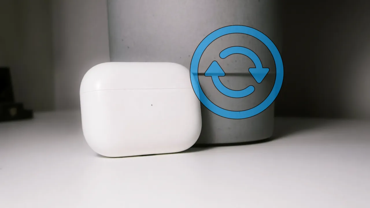 Białe etui AirPods z ikoną resetowania. Dowiedz się, jak zresetować AirPods.
