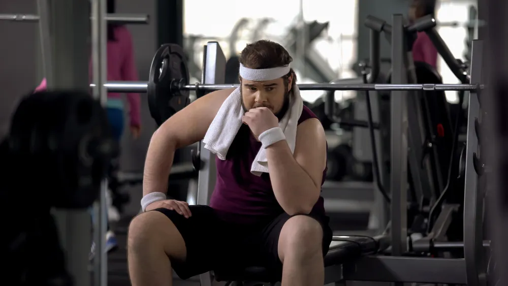 osoba zmagająca się z brakiem motywacji do ćwiczeń