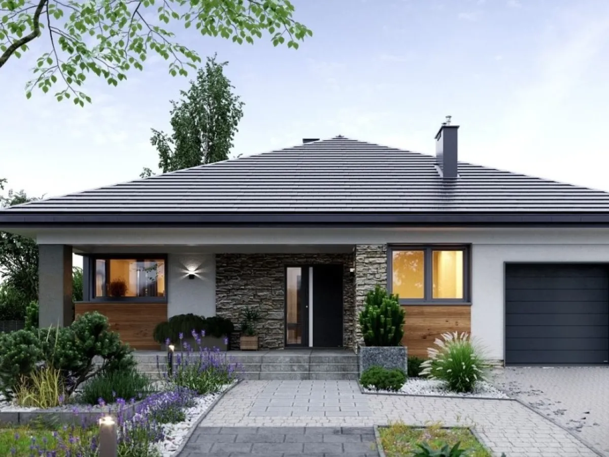Nowoczesny dom z garażem i kamienną elewacją. Zastanawiasz się, ile kosztuje pozwolenie na budowę takiego domu?