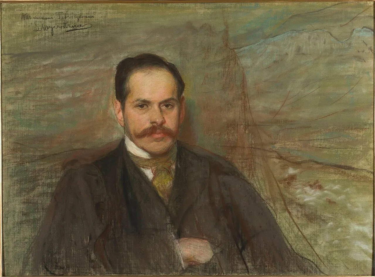 Portret mężczyzny z wąsami, w ciemnym garniturze i ż&oacute;łtej apaszce. Tło sugeruje krajobraz, być może wiersz z Poronina.