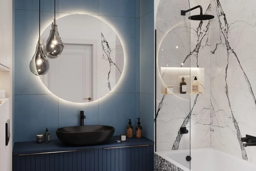 okrągłe lustro nad umywalką w łazience