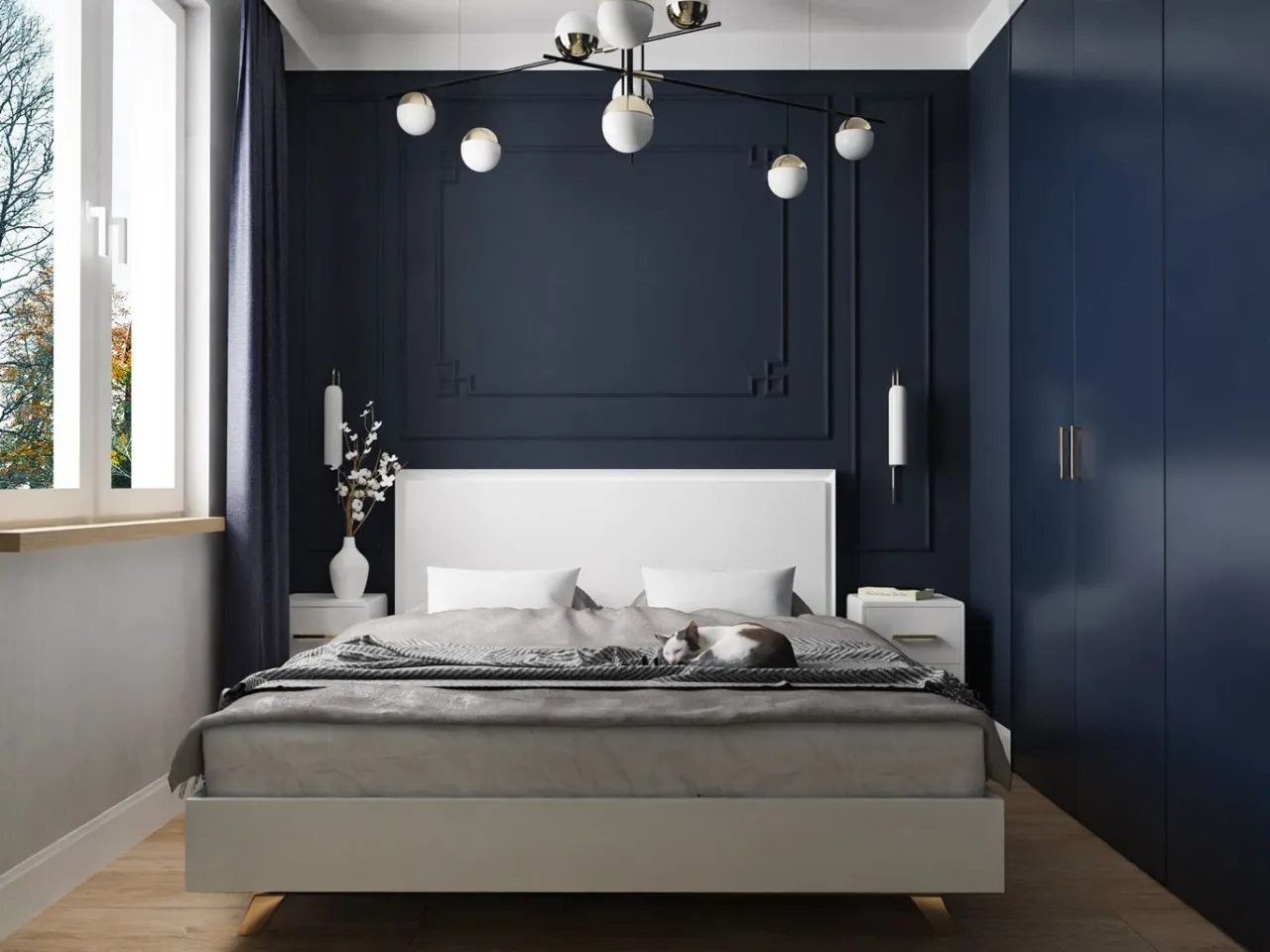 Mała sypialnia z ciemnymi meblami i optycznym powiększeniem