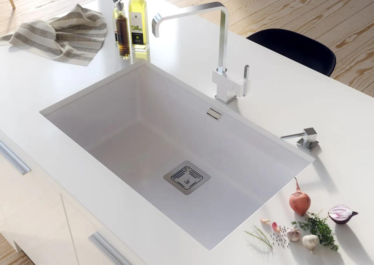 Zlew konglomeratowy z kranem w kuchni
