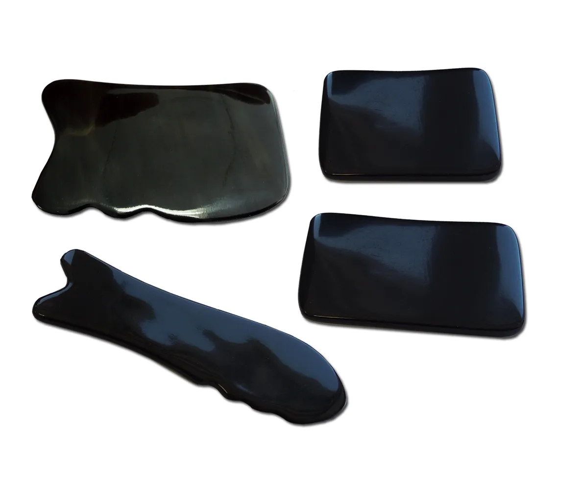 różne kamienie gua sha do masażu twarzy