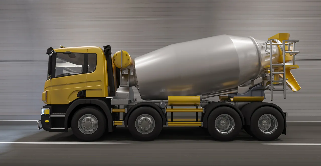 Żółta gruszka betonu na wieloosiowym podwoziu, gotowa do pracy. Zastanawiasz się, ile kosztuje gruszka betonu?