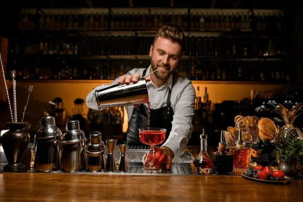 bartender making a cocktail in a stylish American bar