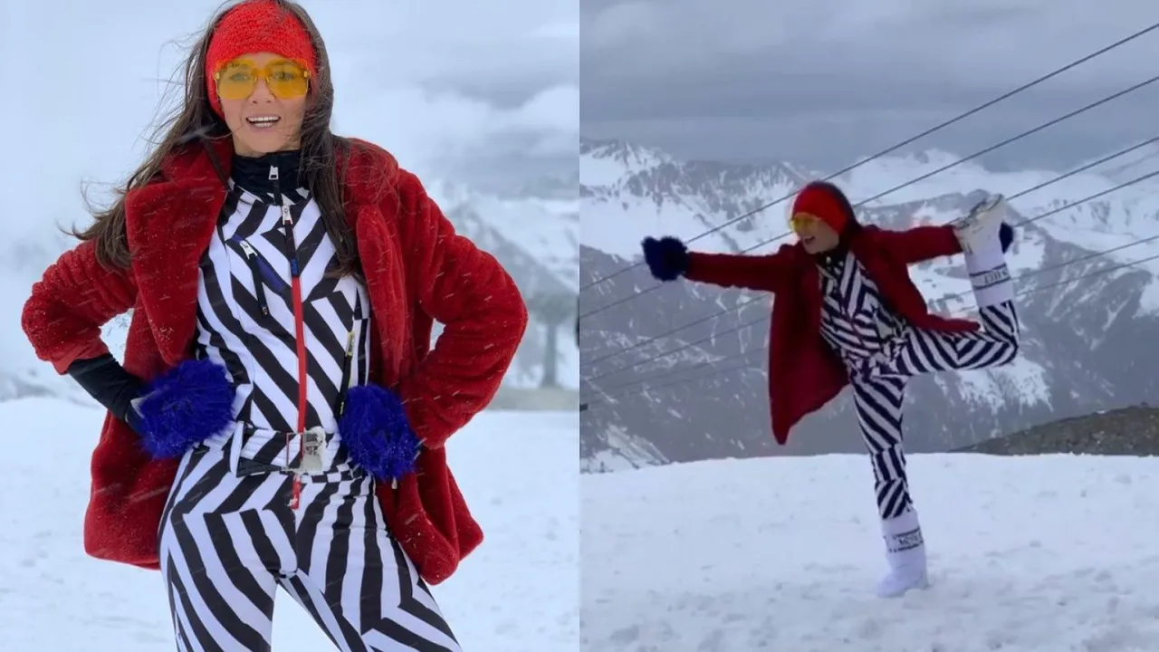 kobieta w kombinezonie narciarskim na stoku