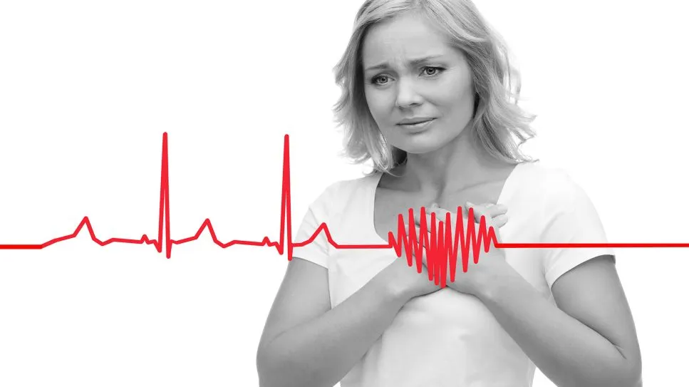 Person mit Schwindel und Herzklopfen, besorgt