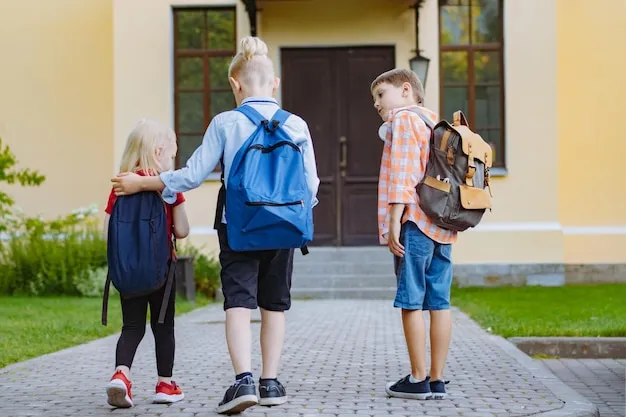 dzieci idące do szkoły z plecakami