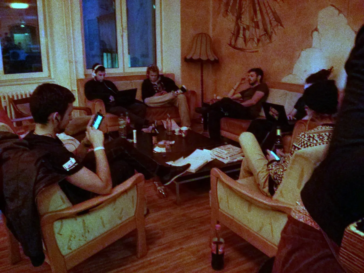 people laughing common room hostel