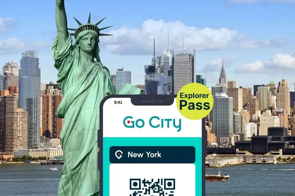 New York Explorer Pass on smartphone in front of skyline