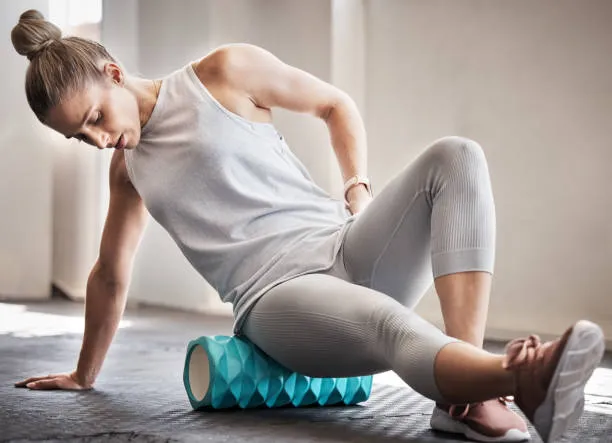 person using foam roller
