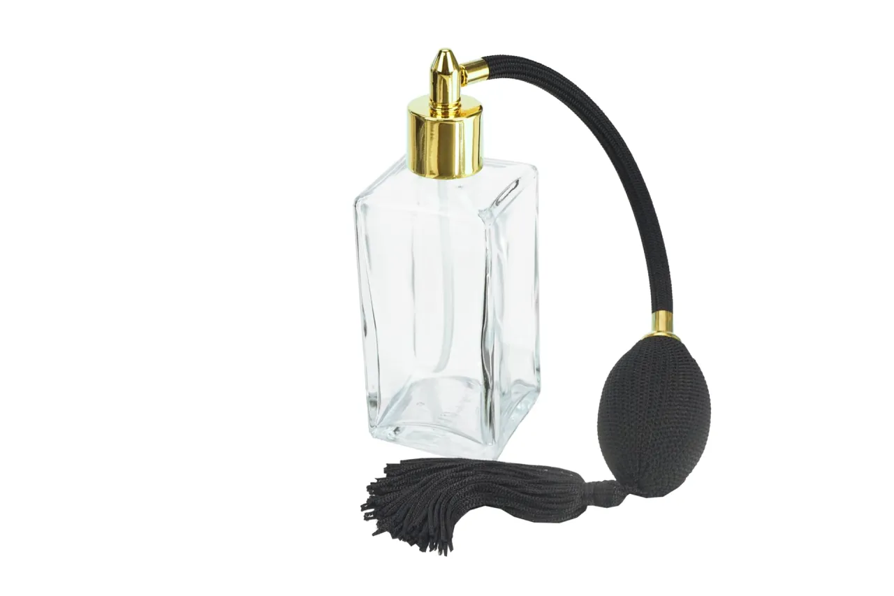 Flakon perfum na tle biurowym, subtelny zapach