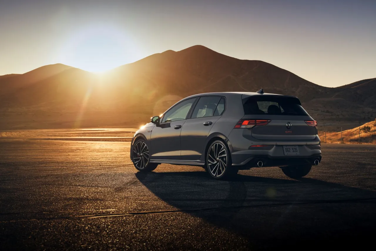 Volkswagen Golf 8 R driving away sunset