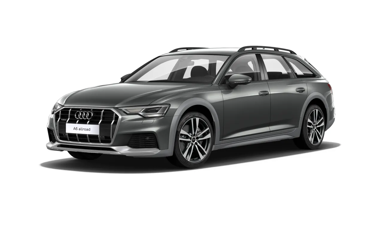 Szare Audi A6 allroad, idealne auto na długie trasy, z relingami dachowymi i eleganckimi felgami.