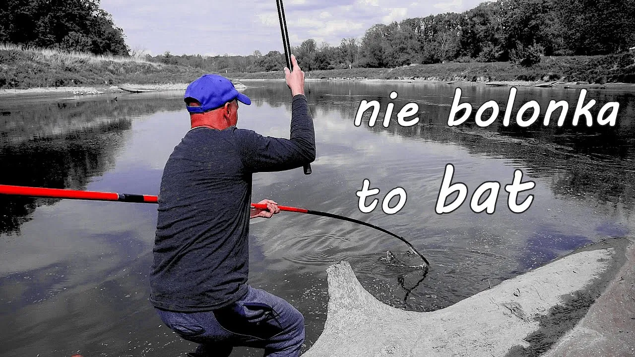 wędka bat na tle jeziora lub rzeki