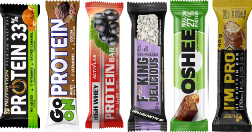 różne batony proteinowe na tle miarki i owoców
