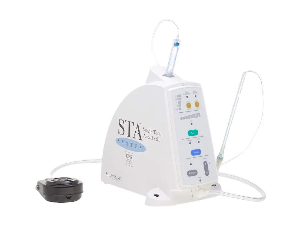 Dentysta używający znieczulenia komputerowego The Wand