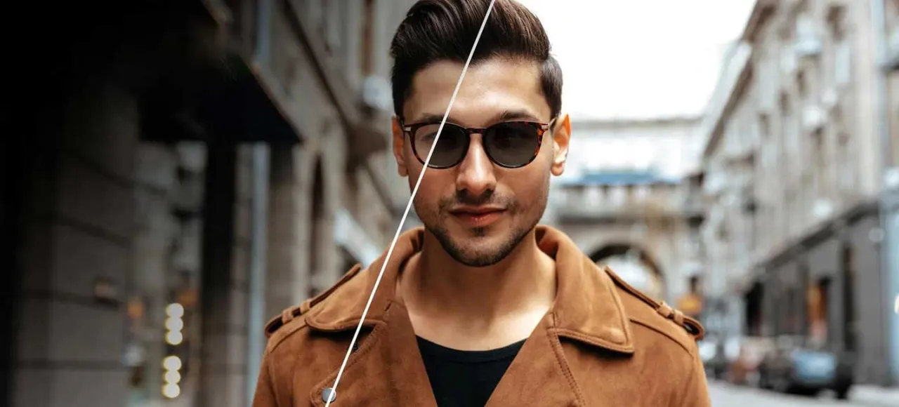 osoba przechodząca z okularami fotochromowymi z wnętrza na zewnątrz