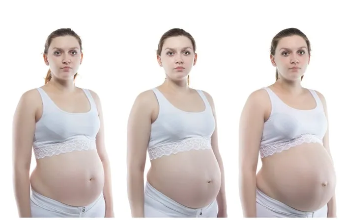 kobieta w ciąży z obniżonym brzuchem