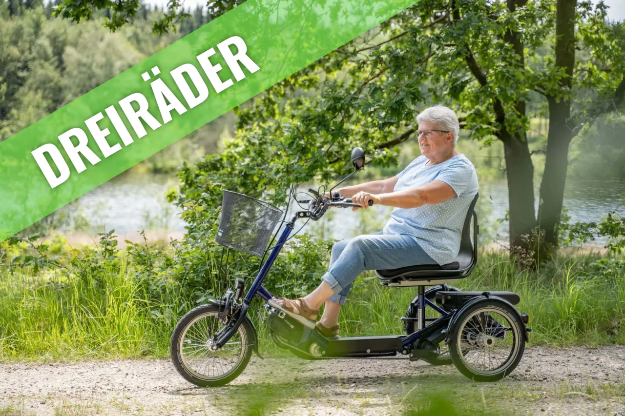 Person fährt Dreirad mit Elektromotor