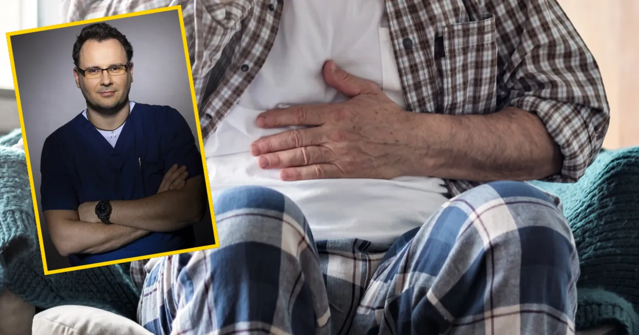 Lekarz w niebieskim kitlu i pacjent z ręką na brzuchu. Czy pr&oacute;by wątrobowe a wysiłek fizyczny mają związek?