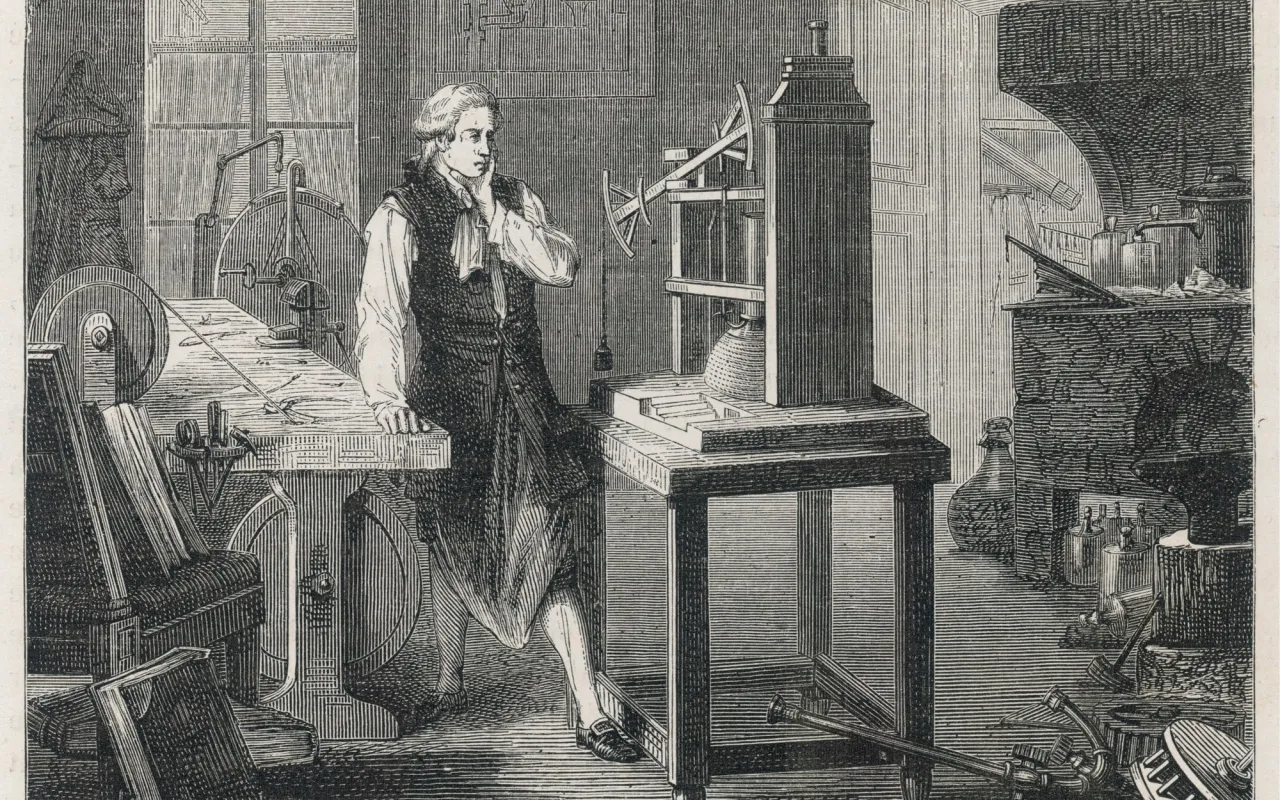 James Watt w pracowni, gdy wynaleziono maszynę parową. Obok niego prototyp maszyny, narzędzia i przyrządy naukowe.