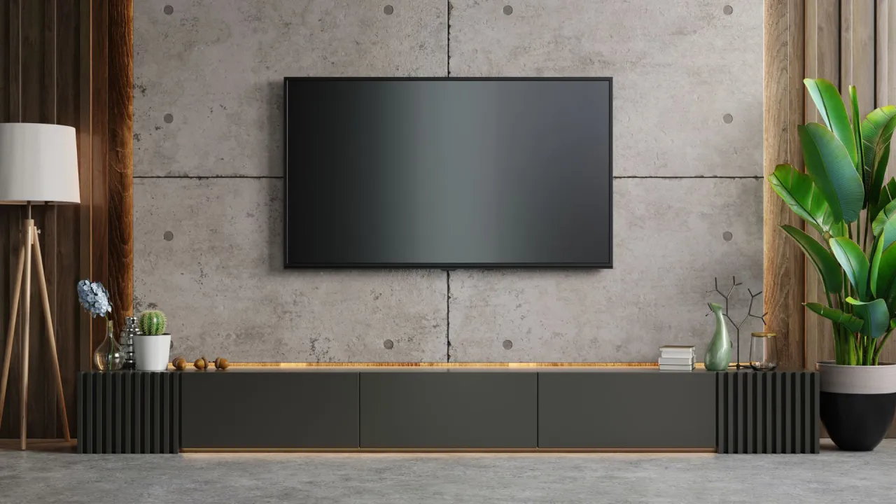 Nowoczesny salon z betonem dekoracyjnym na ścianie. Dowiedz się, jak zrobić beton dekoracyjny na ścianie, by uzyskać taki efekt.