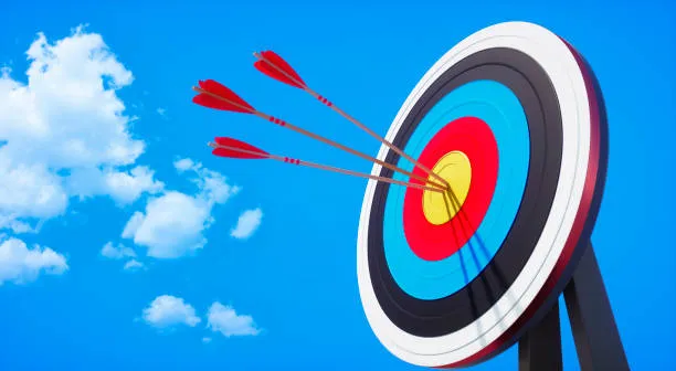 archery target with arrow in the bullseye