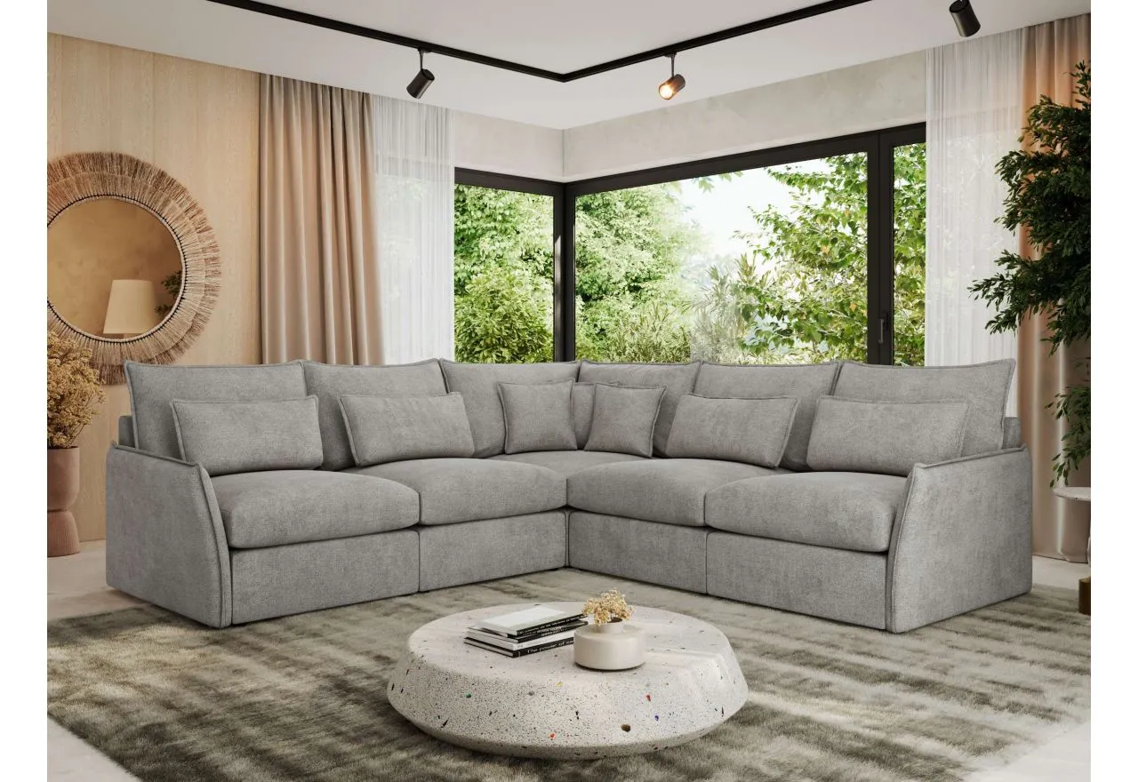 Szary narożnik z siatką, idealny do nowoczesnego salonu. Miękkie poduchy i duża przestrzeń zachęcają do relaksu.