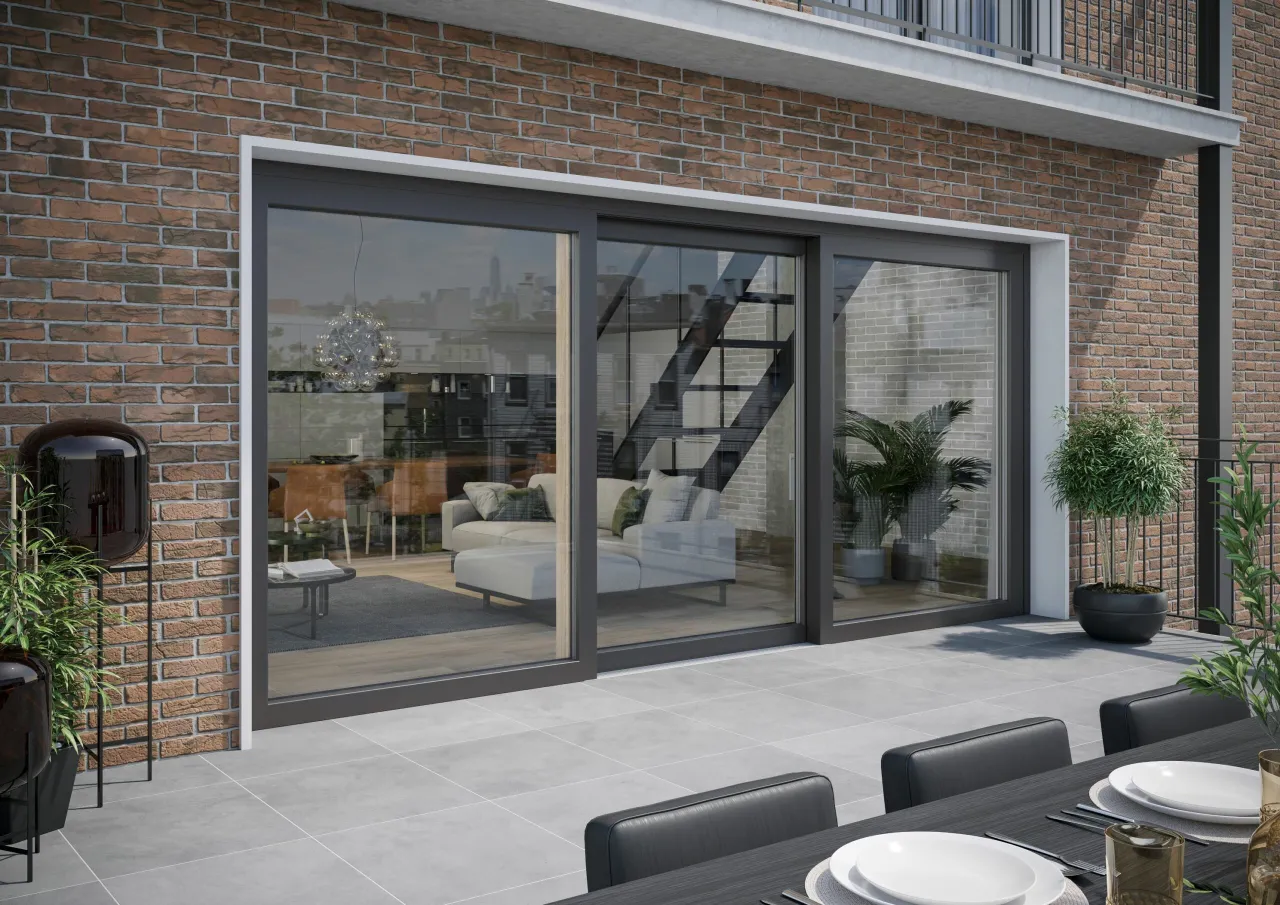 Nowoczesny salon z dużymi drzwiami tarasowymi i widokiem na ogr&oacute;d