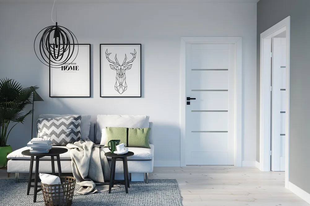 Czarne klamki na białych drzwiach aranżacje