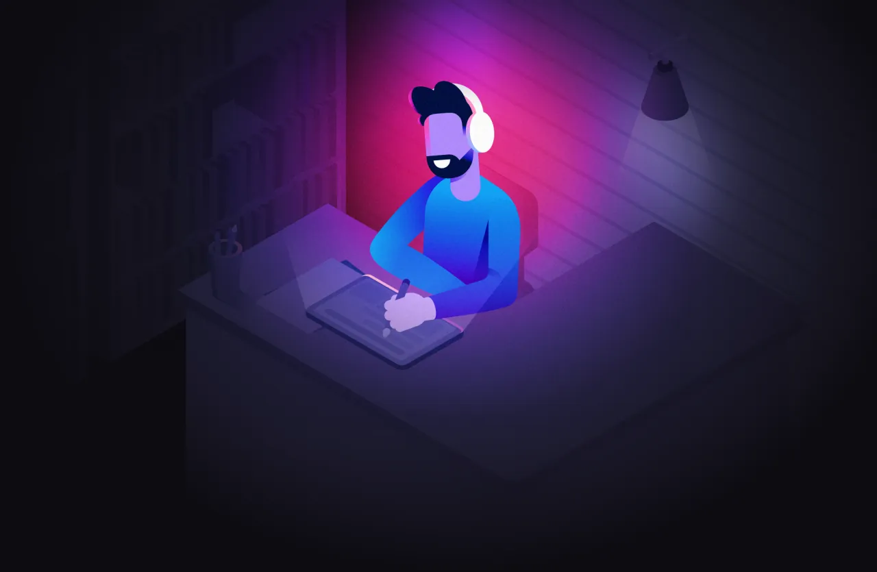 Mężczyzna w słuchawkach pracuje przy tablecie graficznym. Idealna muzyka do nauki i koncentracji.