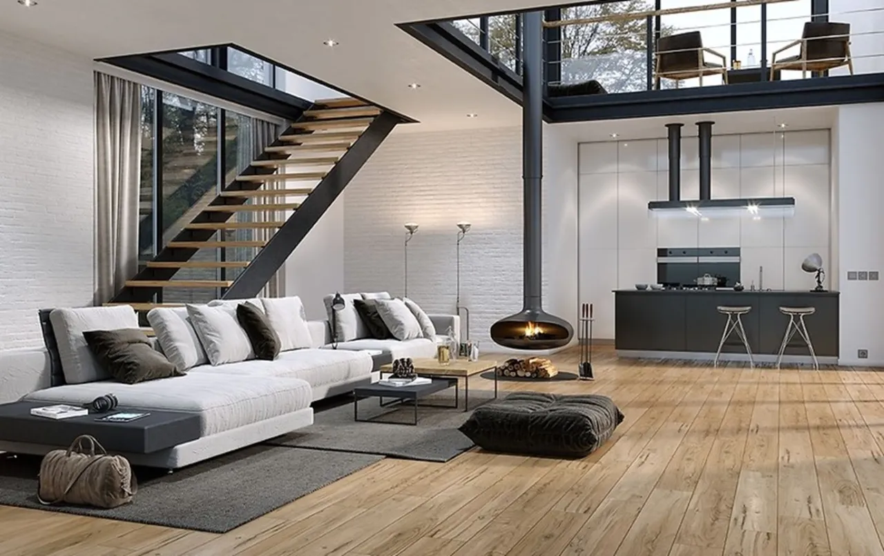 Nowoczesny salon z otwartą kuchnią i antresolą, kt&oacute;ra jest dodatkową kondygnacją. Wygodna sofa, wiszący kominek i schody.