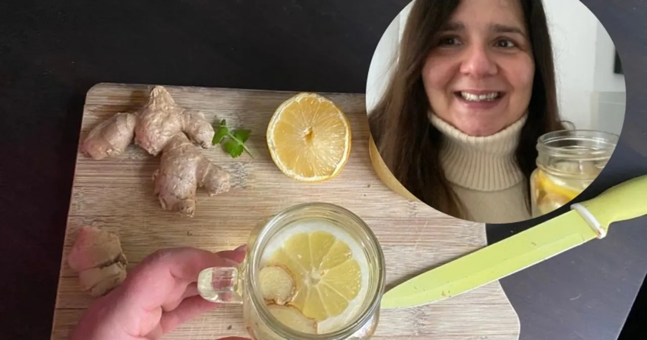 Kobieta pije nap&oacute;j imbirowy z cytryną, w tle chusteczki