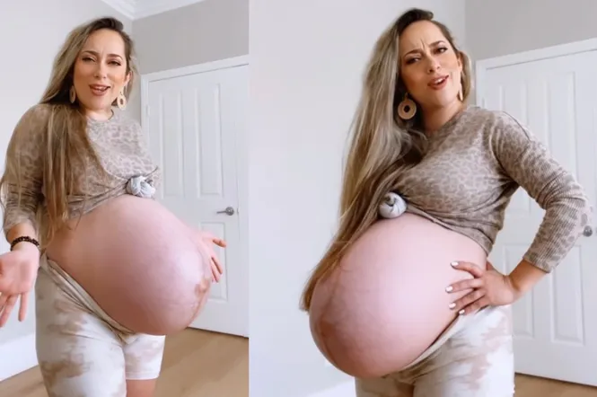 kobieta w ciąży uśmiechnięta, widoczny brzuch