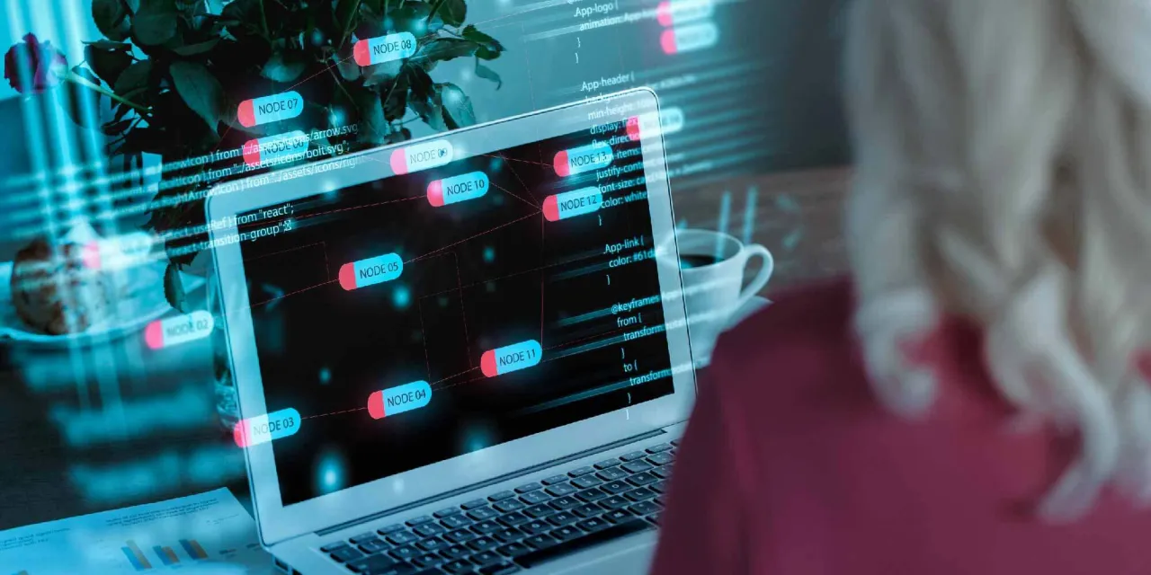 Programista pracuje nad kodem, widoczne są węzły i linie tworzące strukturę, przypominającą deep link.
