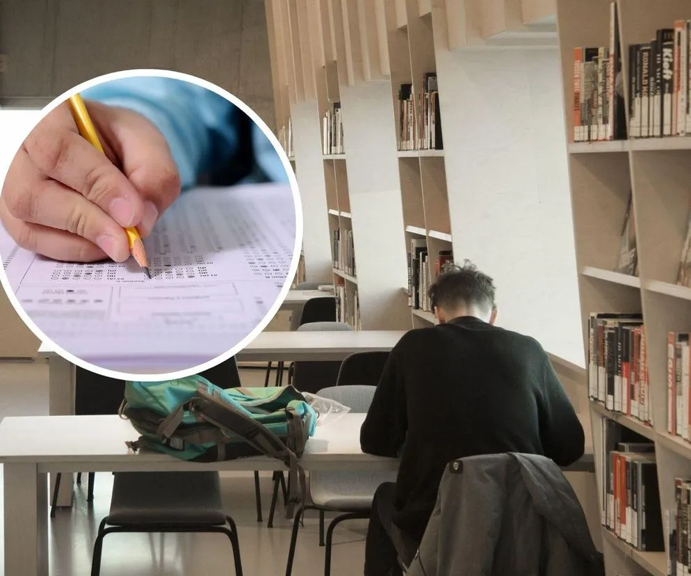 kandydat piszący egzamin w sali egzaminacyjnej