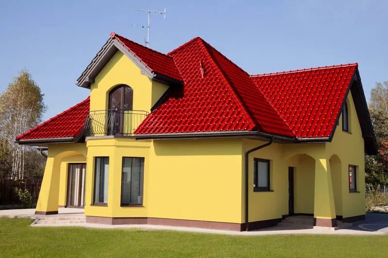 Zdjęcie Jaki kolor dachu do żółtej elewacji? Oto kolory, które zachwycą