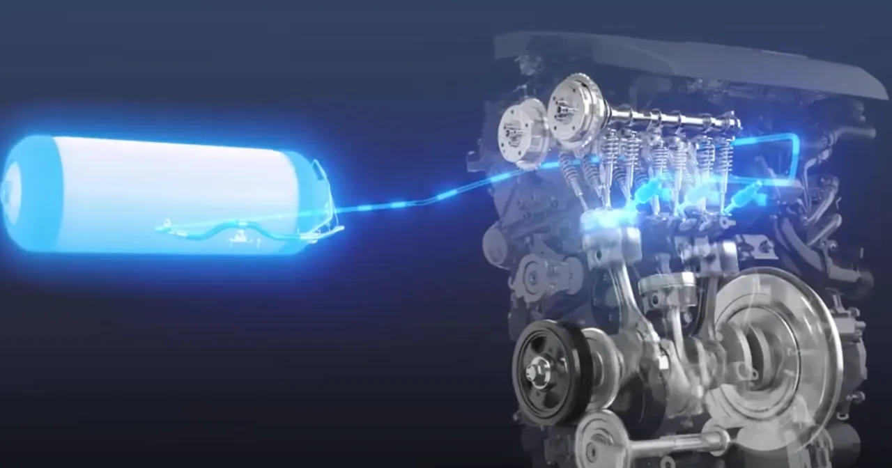 Schemat silnika spalinowego na wod&oacute;r z widocznym zbiornikiem i elementami napędu.