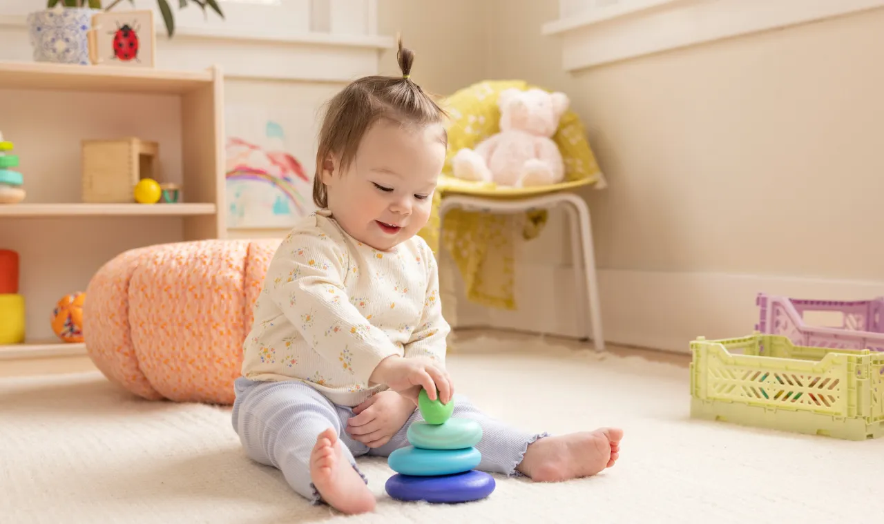 11 month baby first steps playing blocks