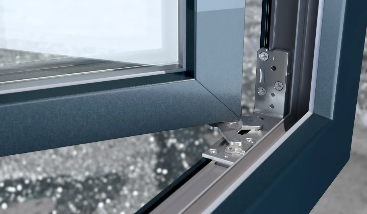 Precyzyjna regulacja okien balkonowych dzięki nowoczesnym okuciom. Widoczny mechanizm zawiasów zapewnia płynne działanie.