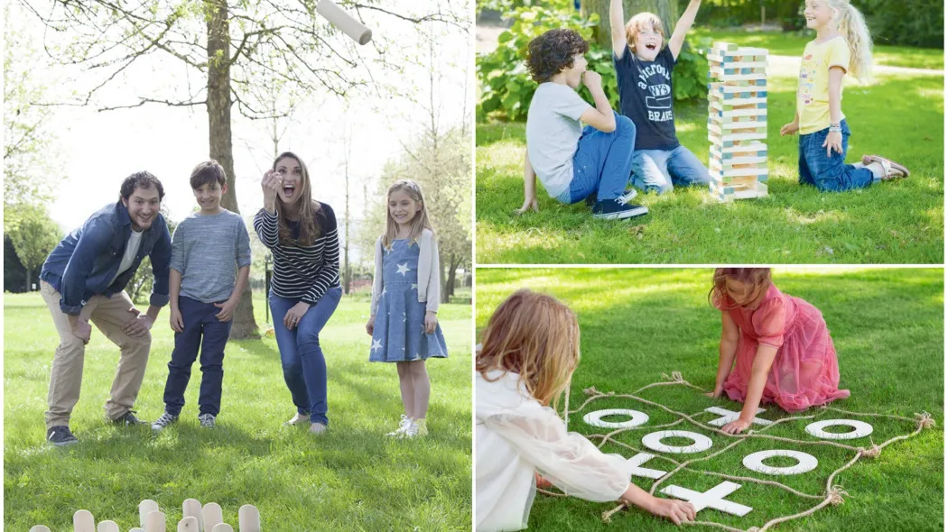 rodzina grająca w podwórkowe gry na świeżym powietrzu