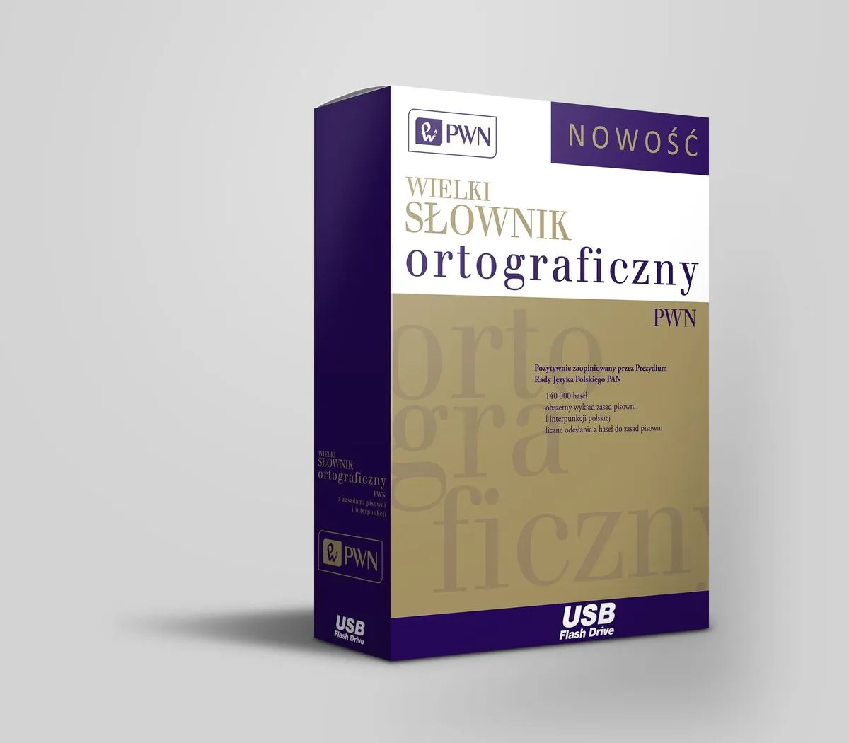 książka Wielki słownik ortograficzny PWN na biurku obok laptopa