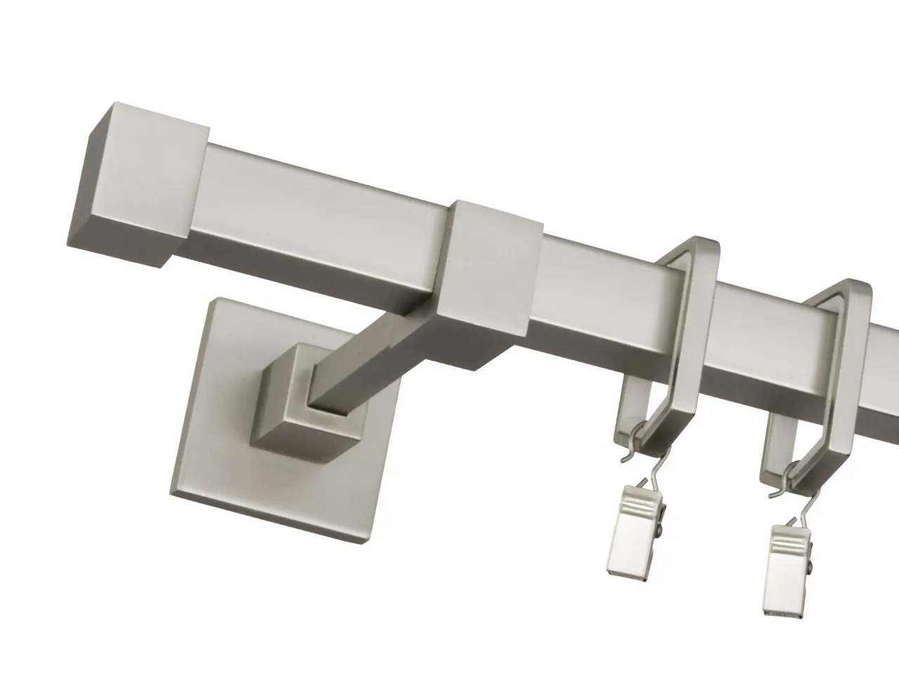 Nowoczesne karnisze Bojanek, gdzie kupić? Elegancki, metalowy karnisz z kwadratowymi zakończeniami i uchwytami na klipsy.